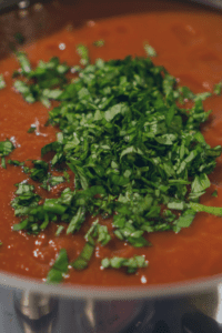 Adding Fresh Basil to the Spaghetti Sauce