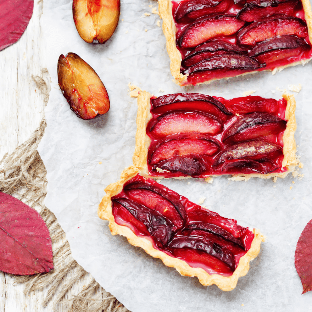 Serving Pieces of a Rectangle Plum Tart Fruit Dessert
